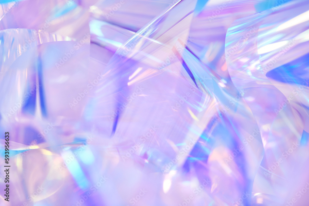 Close-up of ethereal pastel neon blue, purple, lavender, mint holographic metallic foil background. Abstract modern curved blurred surreal futuristic disco, rave, techno, festive dreamlike backdrop Close-up of ethereal pastel neon blue, purple, lavender, mint holographic metallic foil background. Abstract modern curved blurred surreal futuristic disco, rave, techno, festive dreamlike backdrop