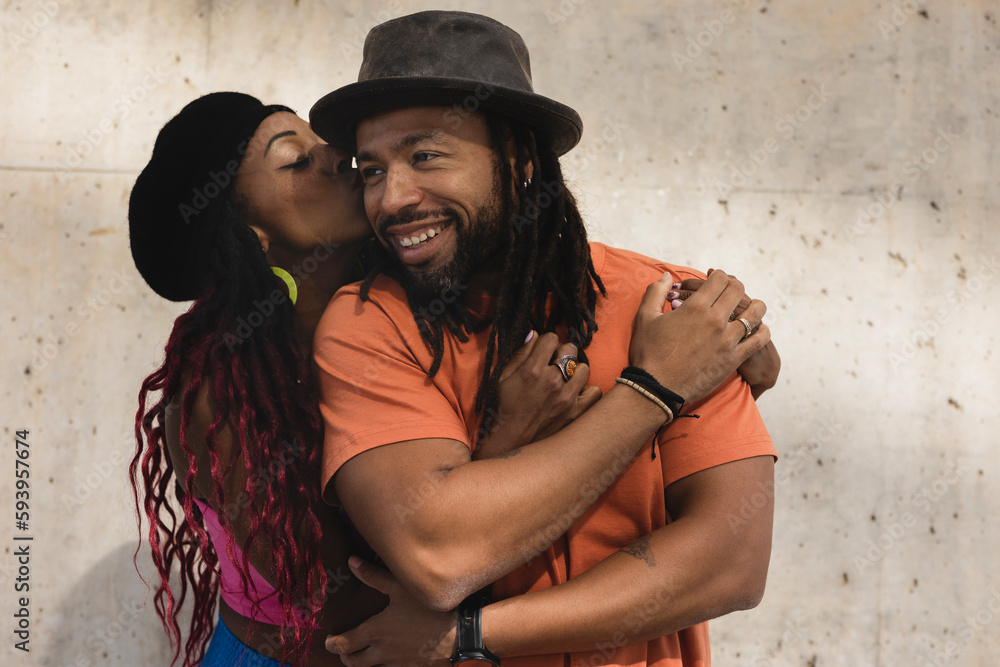 Portrait of African-American couple embracing each other. Smiling happy girlfriend and boyfriend enjoy outside.. Portrait of African-American couple embracing each other. Smiling happy girlfriend and boyfriend enjoy outside..