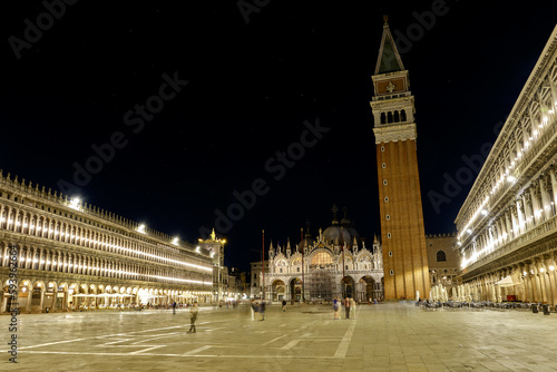 Venice, Italy: Bell tower and historical buildings at night at Piazza San Marco in Venice. © Matteo