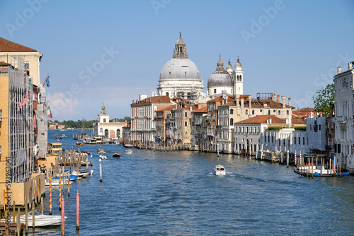 Venice, Italy: Panorama of Venice Grand Canal with boats and Santa Maria della Salute church on sunset from Ponte dell'Accademia bridge. Venice, Italy © Matteo