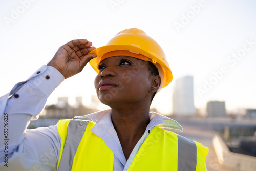 Black female builder in uniform photo