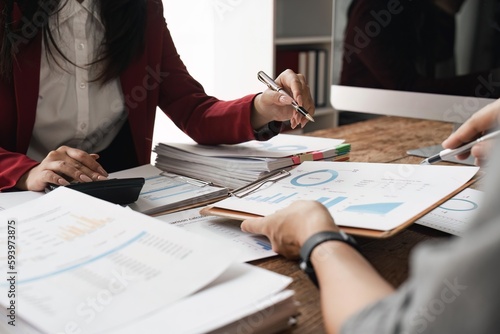 Business team collaboration discussing working analyzing with financial data and marketing growth report graph in team, presentation and brainstorming to strategy planning making profit of company