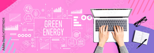 Green Energy concept with person using a laptop computer