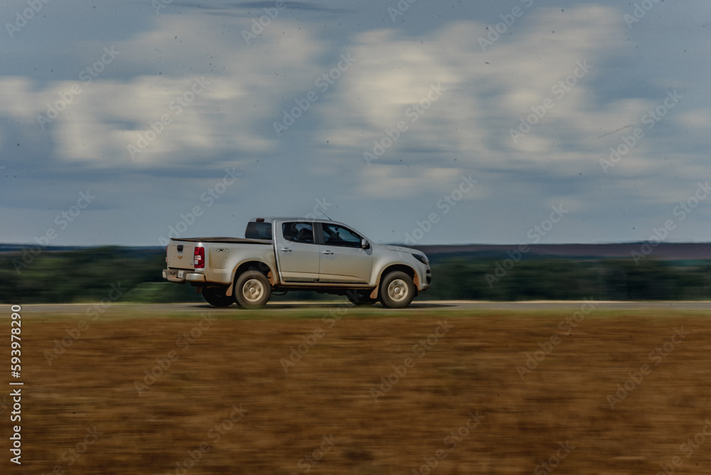 off road vehicle on the road and blue sky off road vehicle on the road and blue sky