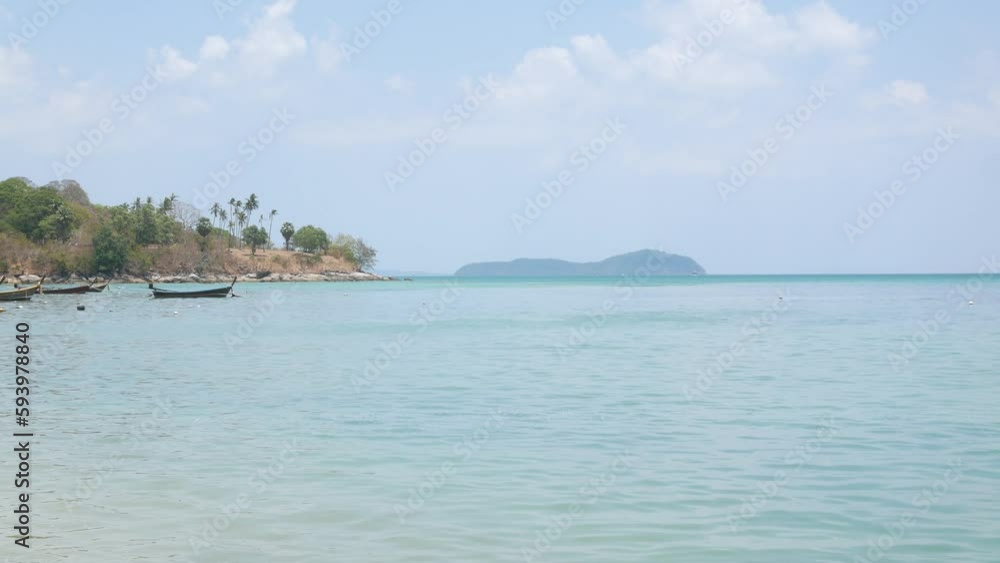 beautiful tropical sea under clear sunny blue sky with green island among turquoise sea with some boat, yacht in summer holiday vacation time. beautiful tropical sea under clear sunny blue sky with green island among turquoise sea with some boat, yacht in summer holiday vacation time.