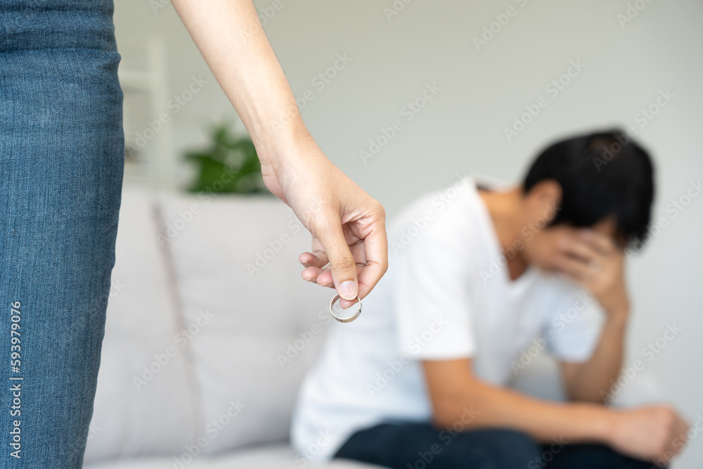 Divorce. Woman remove married ring. Couples desperate and disappointed after marriage. Husband wife sad, upset and frustrated after quarrels conflict. distrust, love problems, betrayals, family, lover Divorce. Woman remove married ring. Couples desperate and disappointed after marriage. Husband wife sad, upset and frustrated after quarrels conflict. distrust, love problems, betrayals, family, lover