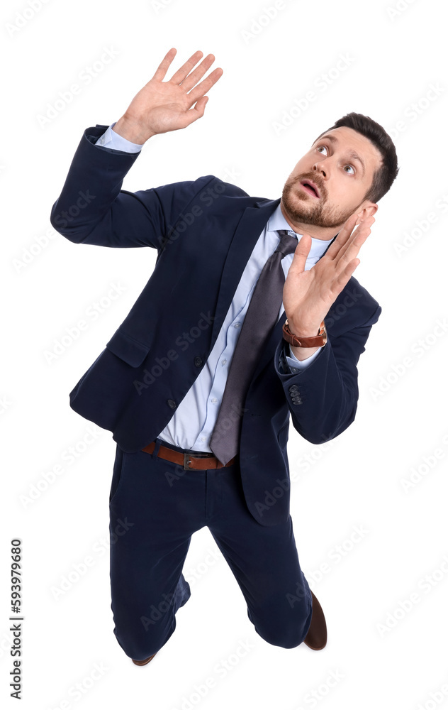 Handsome bearded businessman in suit avoiding something on white background, above view Handsome bearded businessman in suit avoiding something on white background, above view