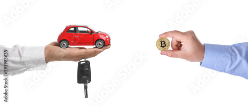 Bitcoin exchange. Man using cryptocurrency to buy car. Seller with key holding miniature automobile model and buyer with bitcoin on white background, closeup