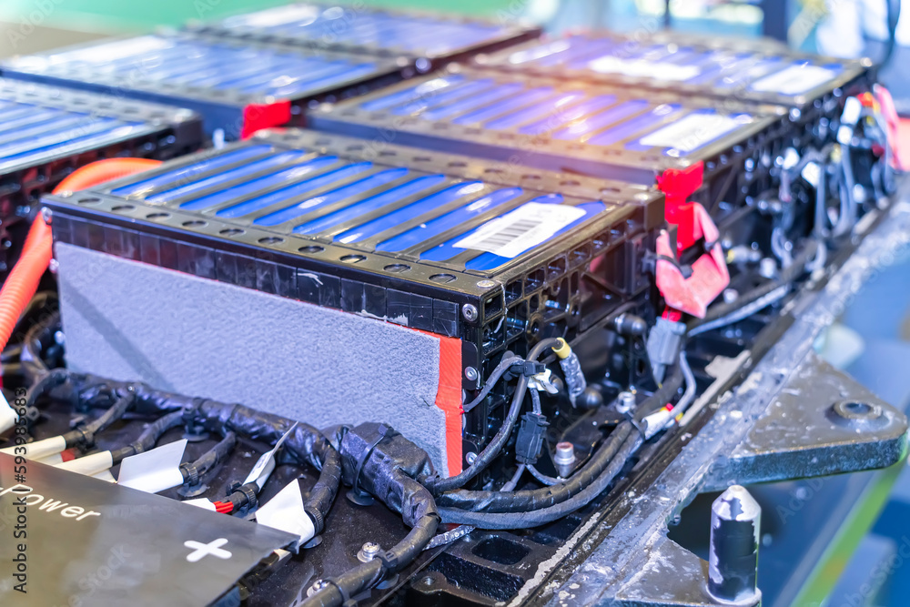 Electric car lithium battery pack and wiring connections internal between cells on background. Electric car lithium battery pack and wiring connections internal between cells on background.