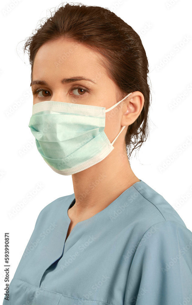 Female healthcare worker wearing a face mask and scrubs Female healthcare worker wearing a face mask and scrubs