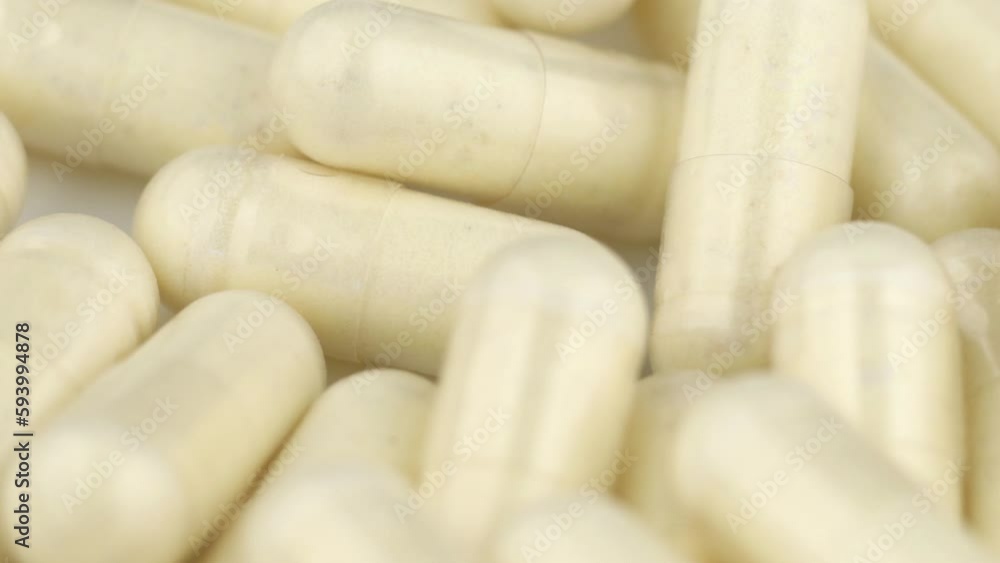 Royal jelly in capsules close-up. Royal jelly in capsules close-up.