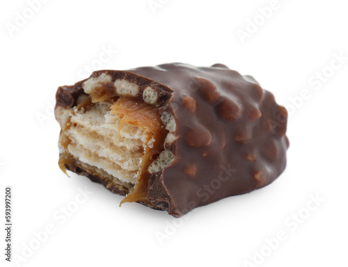 Piece of chocolate bar with caramel on white background