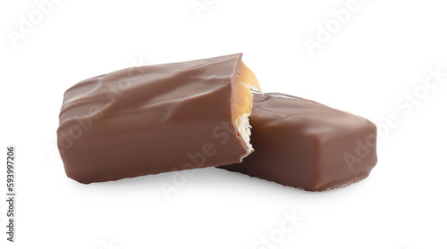 Pieces of chocolate bars with caramel on white background