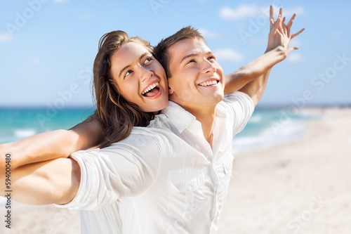 Happy beautiful couple on beach. have fun