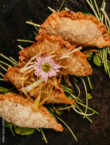 A closeup shot of fried food decorated with a flower