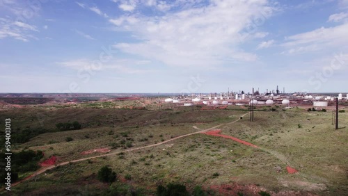 Drone footage of Oil Refinery landscape with blue cloudy sky in Borger city, Texas photo