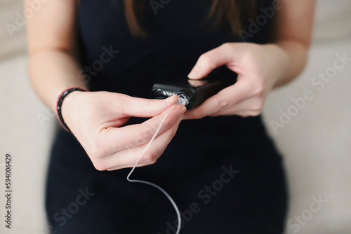 Woman placing a filled reservoir in her insulin pump