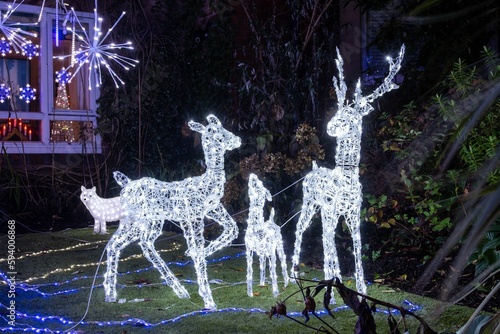 A family of reindeer among Christmas decorations