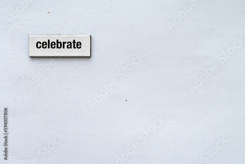 The word "celebrate" wrote on a white background with fridge magnet © Callie Van Huyssteen/Wirestock Creators