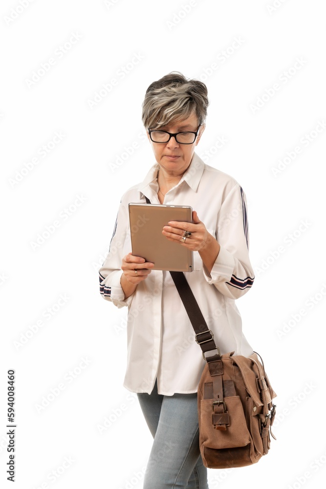 Woman with glasses and briefcase holding a tablet