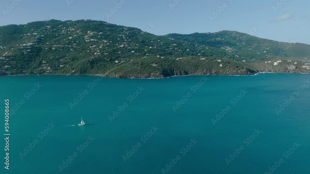 Aerial shot of a sailing boat in Magens bay, turquoise crystal clear water Virgin Islands Aerial shot of a sailing boat in Magens bay, turquoise crystal clear water Virgin Islands