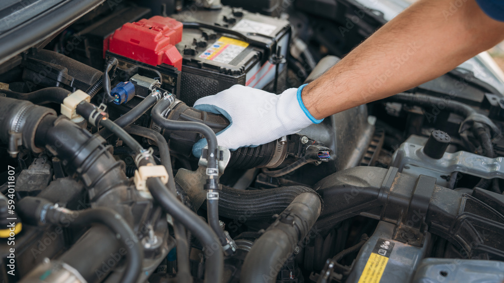 Young man checking and maintenance on his car. Car repair and maintenanc concept. Young man checking and maintenance on his car. Car repair and maintenanc concept.