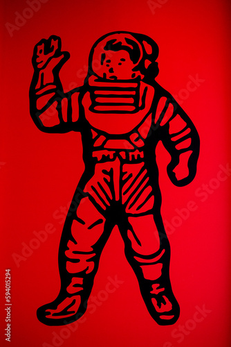 The image of an astronaut on a red background