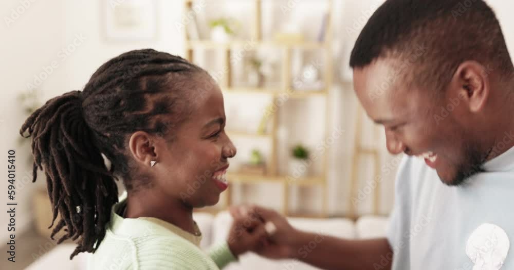 Conversation, face and happy black couple dance, bond and enjoy quality time together in living room. Wellness, music and home energy of romantic man, woman or marriage people dancing with freedom Conversation, face and happy black couple dance, bond and enjoy quality time together in living room. Wellness, music and home energy of romantic man, woman or marriage people dancing with freedom