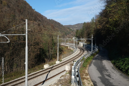 Railroad winding in valley between mountains