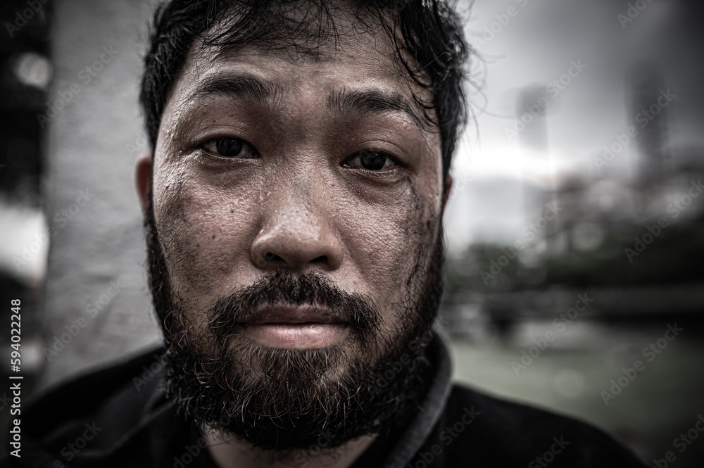 Asian man is homeless at the side road,A stranger has to live on the road alone because he has no family. Asian man is homeless at the side road,A stranger has to live on the road alone because he has no family.