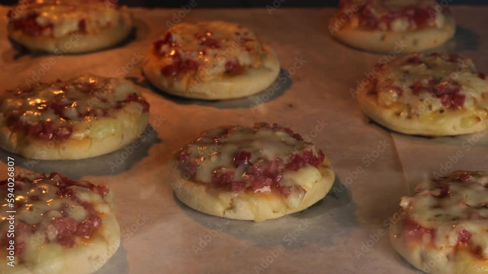 homemade Italian mini pizza in the oven. Timelapse video of pizzetta baked in the oven. Close-up Homemade Mini Pizza grow homemade Italian mini pizza in the oven. Timelapse video of pizzetta baked in the oven. Close-up Homemade Mini Pizza grow