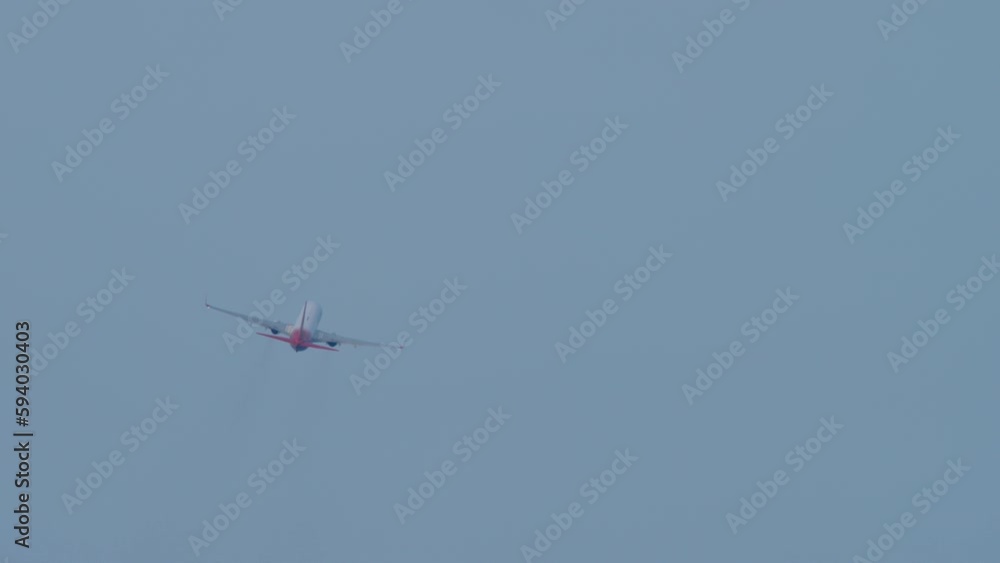 Rear view airplane takeoff, departure. Tourism and travel concept. Airliner flies away Rear view airplane takeoff, departure. Tourism and travel concept. Airliner flies away