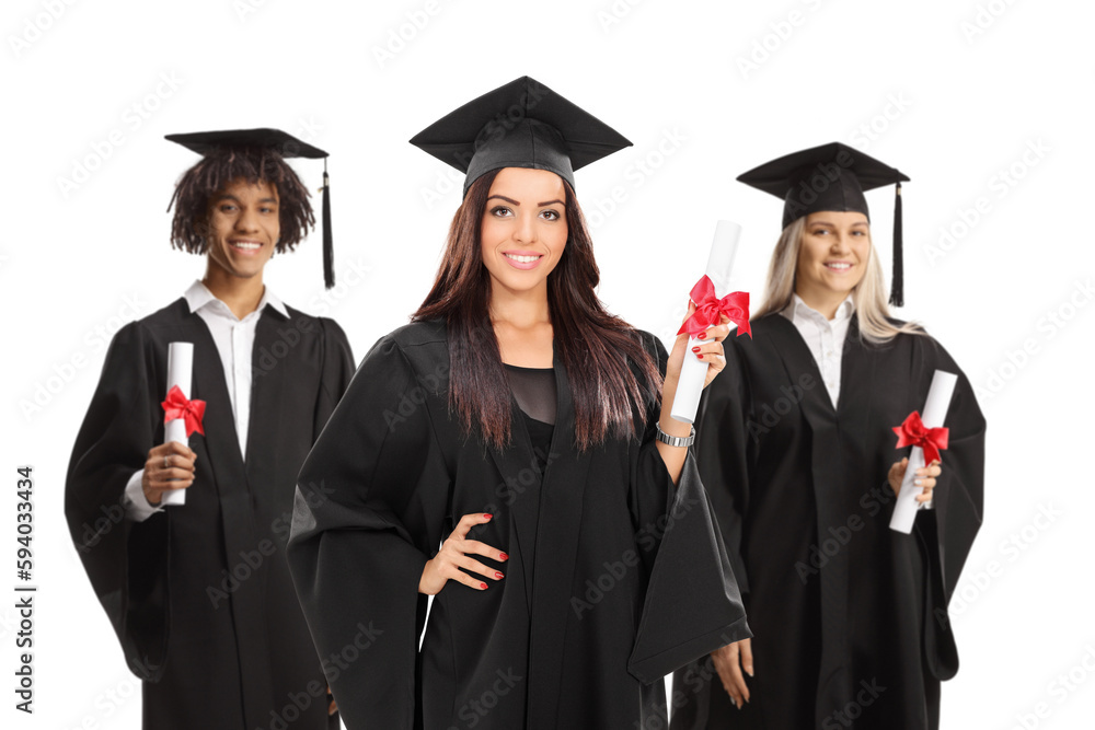 Group of male and female graduate students in gowns holding diplomas Group of male and female graduate students in gowns holding diplomas