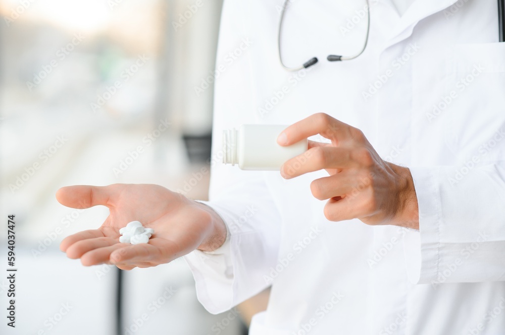 Doctor's hand offering pills. Healthcare concept. Doctor's hand offering pills. Healthcare concept.