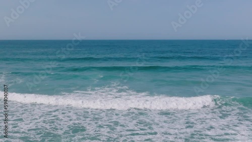 Tidal Ocean Waves Slowly Going Onto Shoreline In Razo Beach, Carballo, Spain. Slow Motion photo