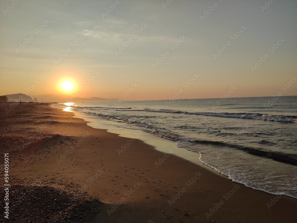 sunset at the beach, beautiful view on the seaside at sunset, travel at the sea, vacation