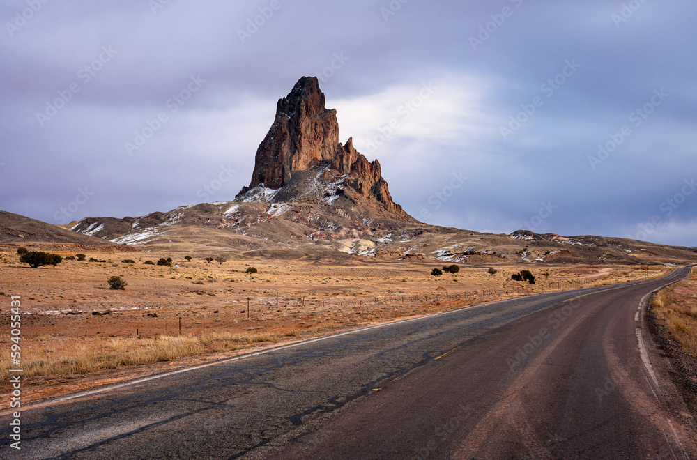Agathla Peak towering over the desert landscape south of Monument Valley along Highway US Route 163 in northern Arizona, United States. Agathlan, El Captian.