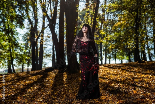 Scary corpse bride in the autumn forest