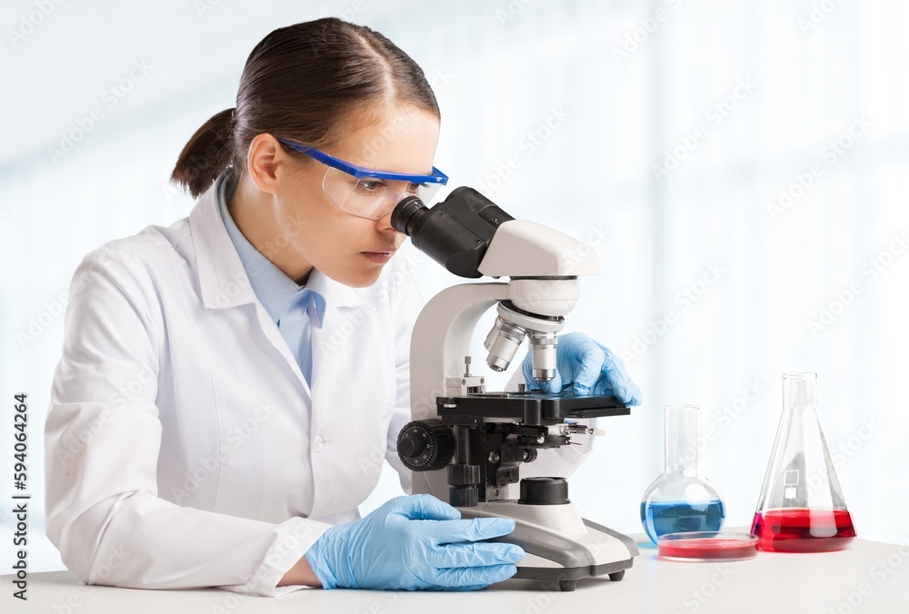 Medical Laboratory, Beautiful Scientist Looking in Microscope Medical Laboratory, Beautiful Scientist Looking in Microscope