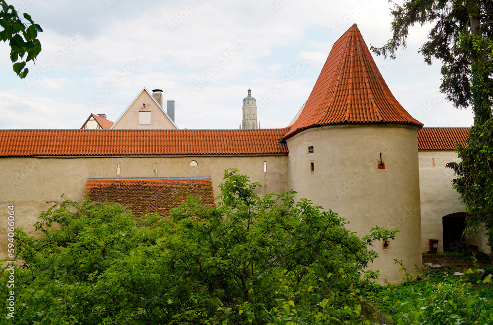 a beautiful ancient Bavarian town of Noerdlingen with its half-timbered houses and Saint George's Church's steeple called a beautiful ancient Bavarian town of Noerdlingen with its half-timbered houses and Saint George's Church's steeple called
