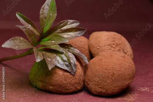 Candy truffle, close-up, brown background, chocolate sweets.