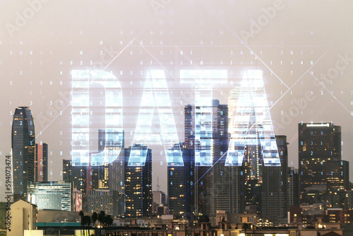 Data word hologram on Los Angeles office buildings background, big data and blockchain concept. Multiexposure