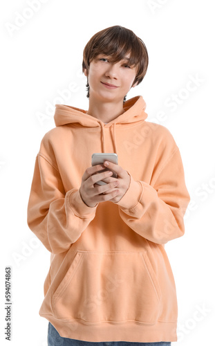 Teenage boy using mobile phone on white background