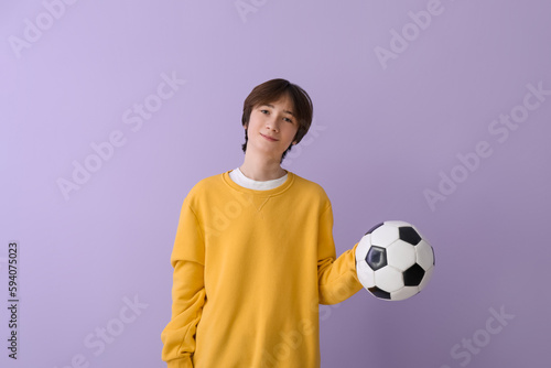 Teenage boy with soccer bal...