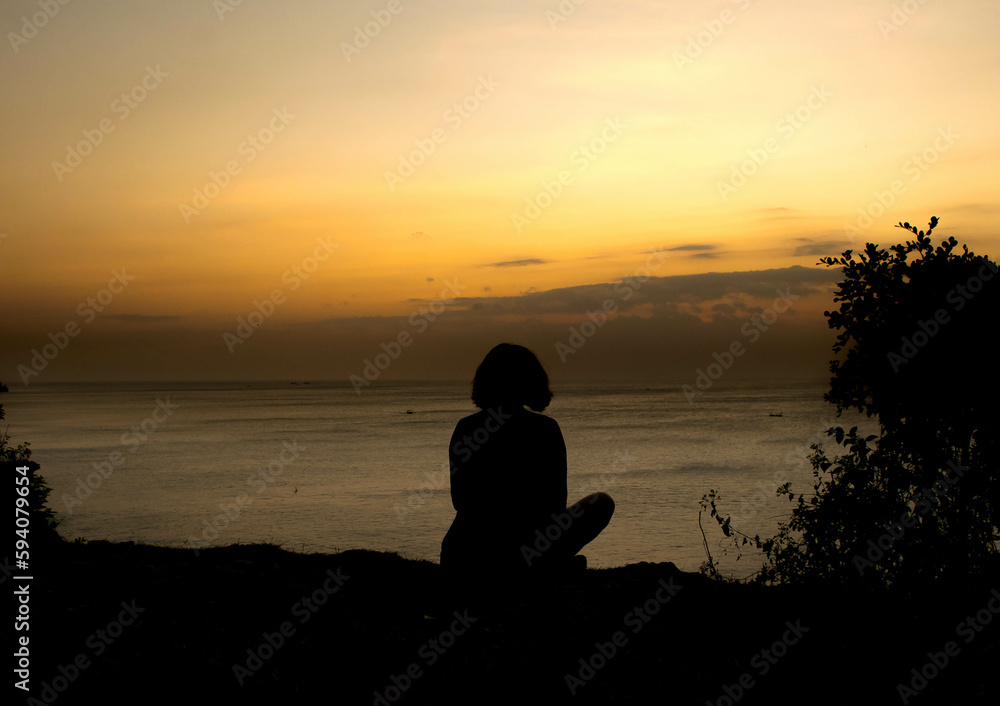 silhouette of a person on a sunset