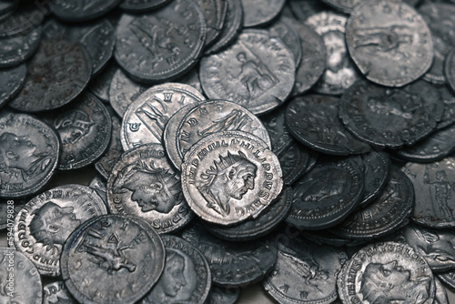 Ancient Roman silver coins on full background. Archaeological treasure (concepts, collecting, riches)