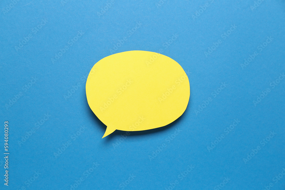 Blank paper speech bubble on blue background Blank paper speech bubble on blue background