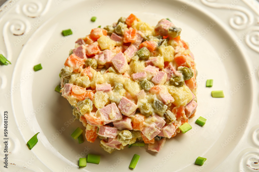 Tasty Olivier salad on plate, closeup Tasty Olivier salad on plate, closeup