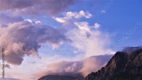 Bilde på lerret Mountain with big purple clouds panoramic scenery