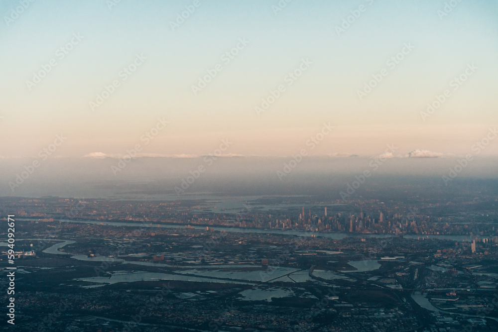 view of new york and new jersey from the plane on sunset